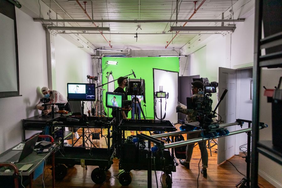 Video production equipment in front of green screen
